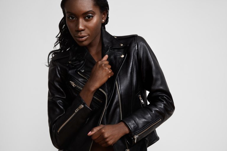 black woman wearing classik biker jacket with that punk 90s look