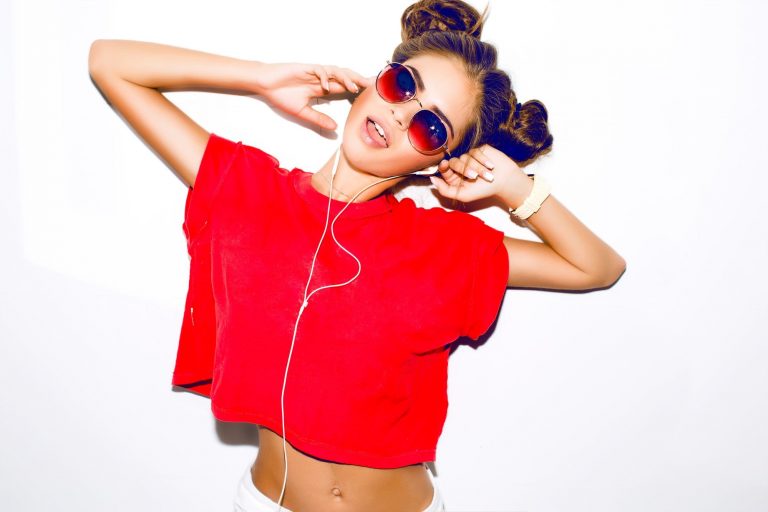 Female wearing a red crop top with sunglasses